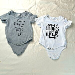 Bundle of two “dog themed” unisex baby onesies. These are in GREAT CONDITION.